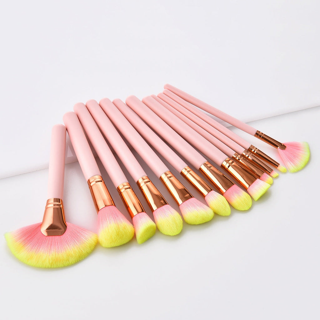 Pink 12-piece makeup brush set with nylon bristles and wooden handles