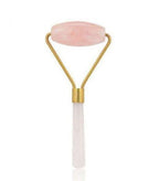 Green and pink jade facial massage roller made from natural stone