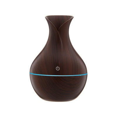 Vase-shaped portable humidifier with 130ml tank and quiet mist output