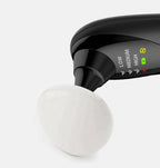 Portable black and white beauty instrument with heat, vibration, and suction