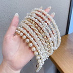 White pearl headband for women with imitation pearls on a metal band