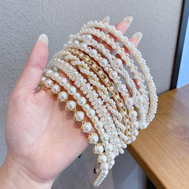 White pearl headband for women with imitation pearls on a metal band