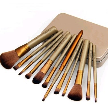 12-piece makeup brush set with wooden handles stored in an iron box