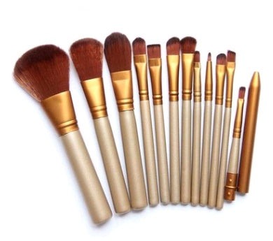 12-piece makeup brush set with wooden handles stored in an iron box