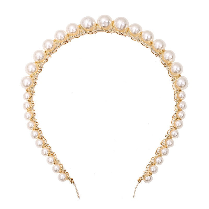 White pearl headband for women with imitation pearls on a metal band
