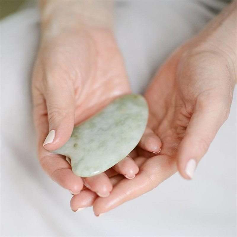 Natural jade Gua Sha scraping tool with smooth curved edges