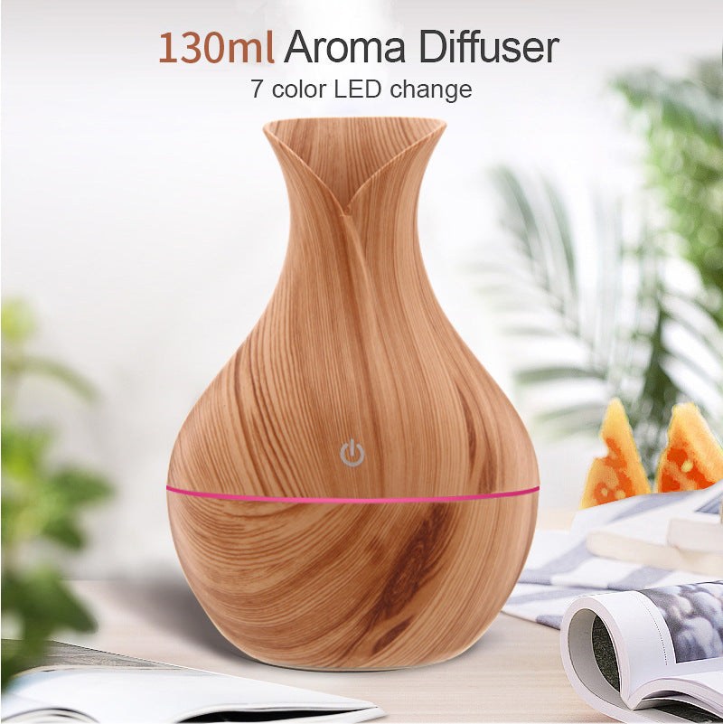 Vase-shaped portable humidifier with 130ml tank and quiet mist output