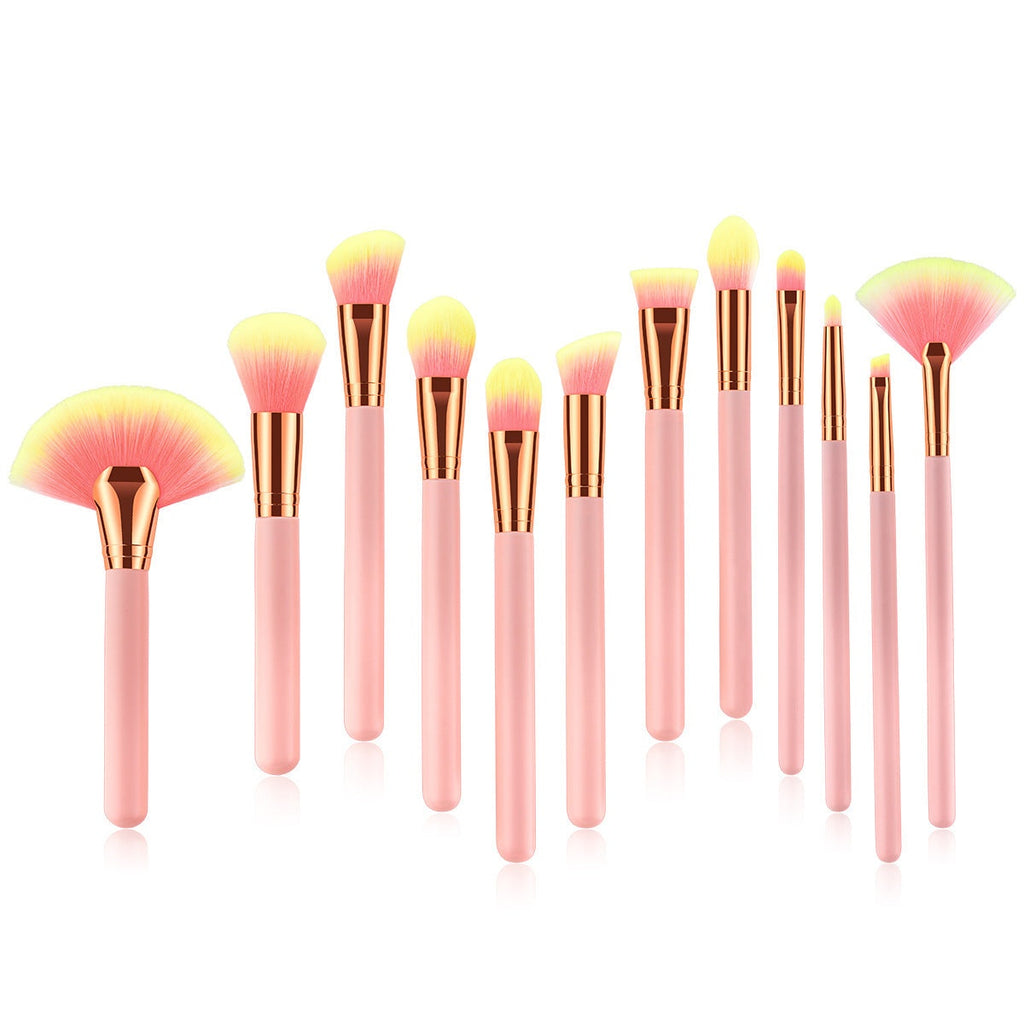 Pink 12-piece makeup brush set with nylon bristles and wooden handles