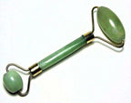 Green and pink jade facial massage roller made from natural stone
