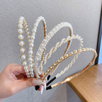 White pearl headband for women with imitation pearls on a metal band