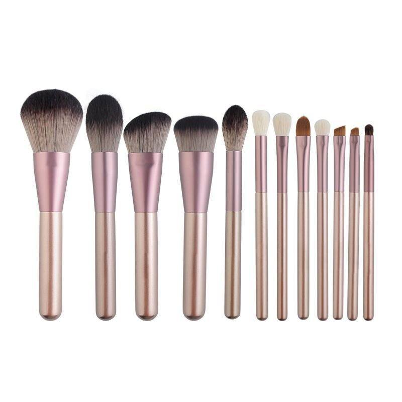 Pink makeup brush set with soft bristles and pink clutch bag