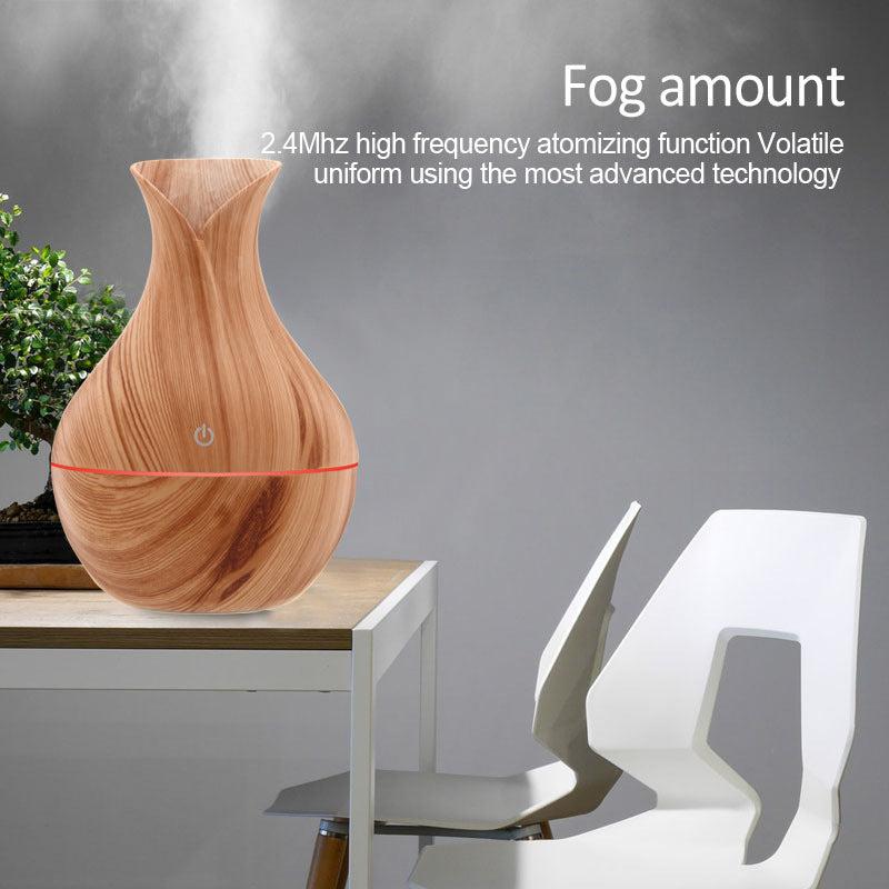 Vase-shaped portable humidifier with 130ml tank and quiet mist output