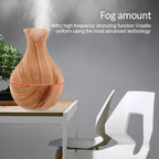 Vase-shaped portable humidifier with 130ml tank and quiet mist output