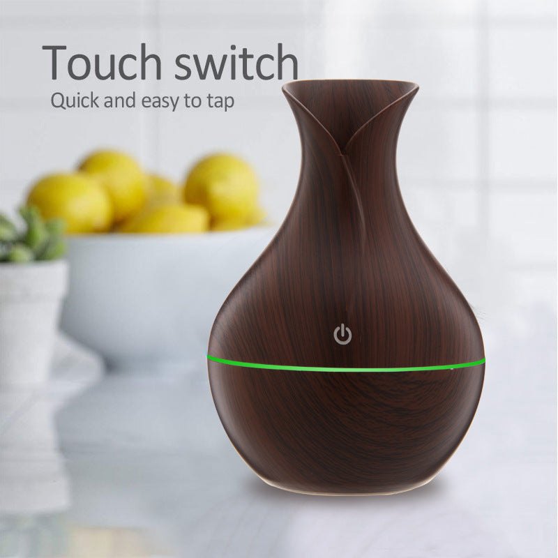 Vase-shaped portable humidifier with 130ml tank and quiet mist output