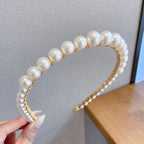 White pearl headband for women with imitation pearls on a metal band