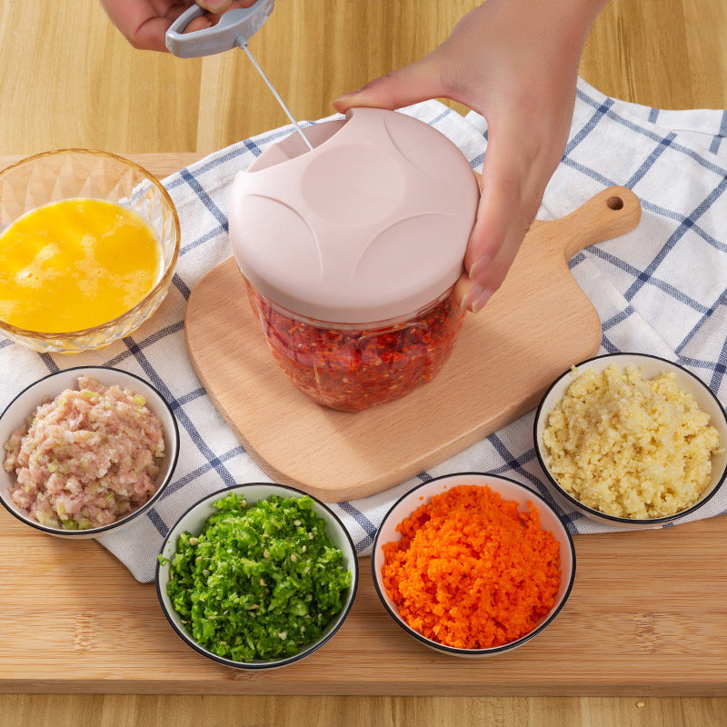 Manual Vegetable Cutter in small pink, blue, and green colors