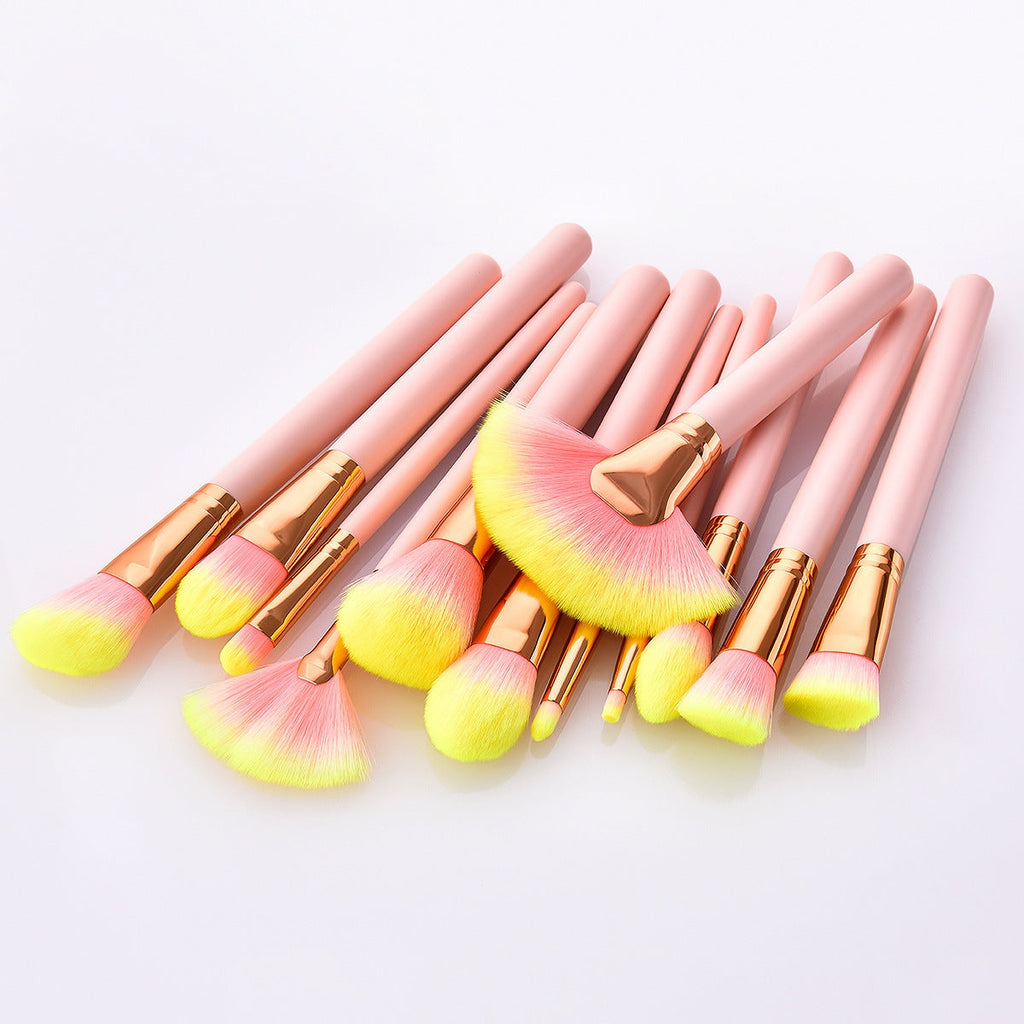 Pink 12-piece makeup brush set with nylon bristles and wooden handles