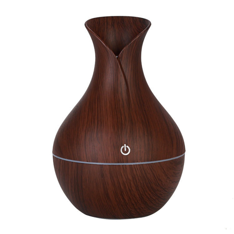 Vase-shaped portable humidifier with 130ml tank and quiet mist output