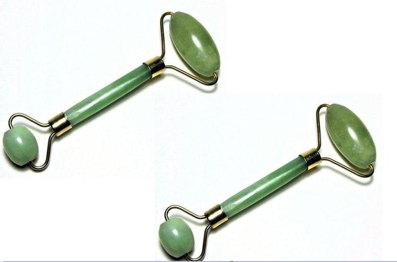 Green and pink jade facial massage roller made from natural stone
