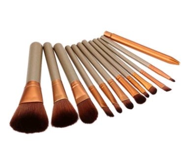 12-piece makeup brush set with wooden handles stored in an iron box