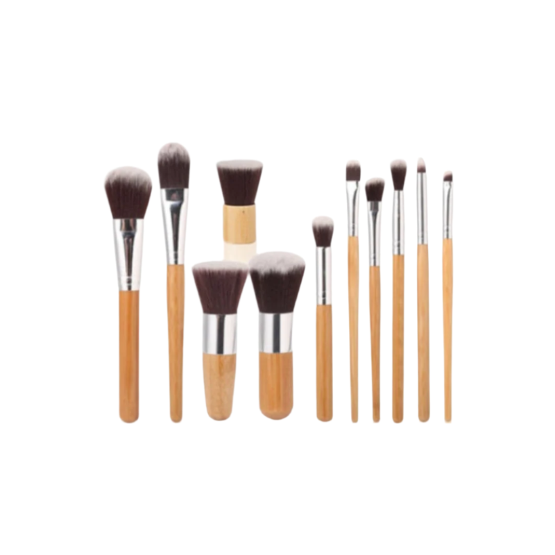 Set of makeup brushes with wooden handles on a white background