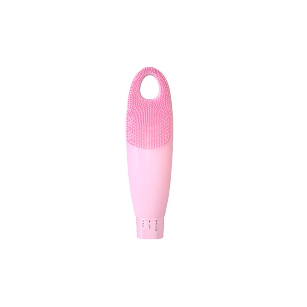 Pink silicone brush with textured head on a white background